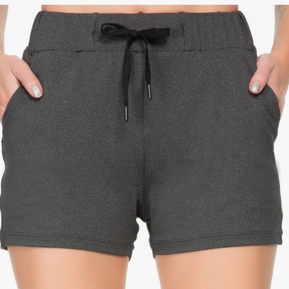 NWT Kcutteyg women’s running shorts, size small, gray. Elastic waist, pockets.